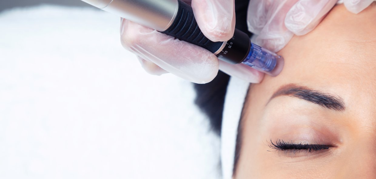 Shot of cosmetologist making mesotherapy injection with dermapen on face for rejuvenation on the spa center.